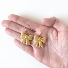 Load image into Gallery viewer, christmas bow earrings in gold
