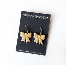 Load image into Gallery viewer, christmas bow earrings in gold
