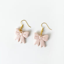 Load image into Gallery viewer, christmas bow earrings in pink champagne
